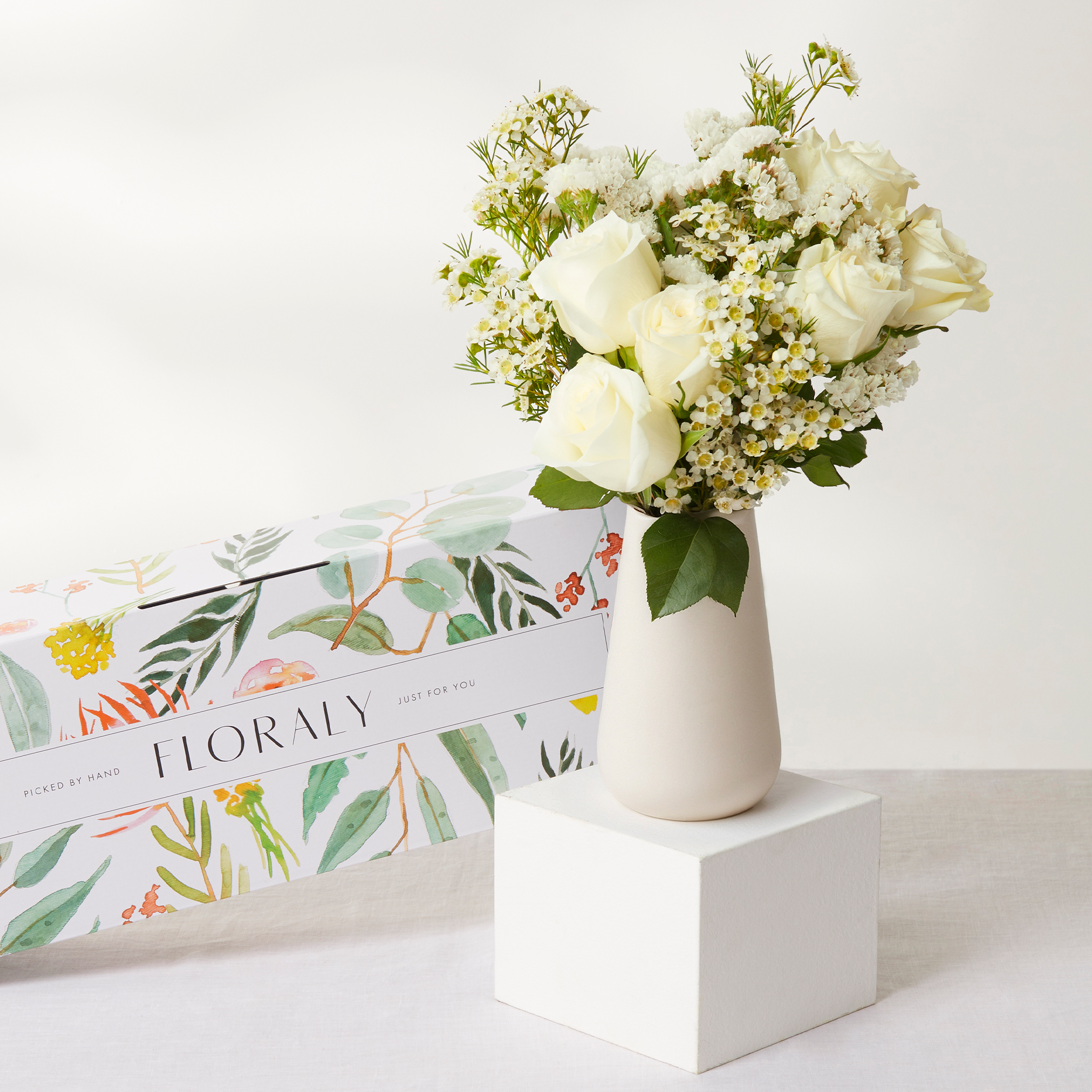 White bouquet with ceramic vase